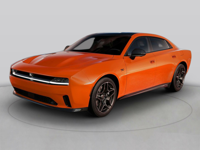 A stock image of the Dodge Charger Daytona EV with Scat Pack in its classic orange color scheme.