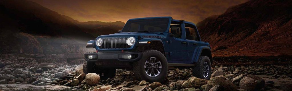 Off-road Jeep Wrangler Rubicon on rocky terrain.