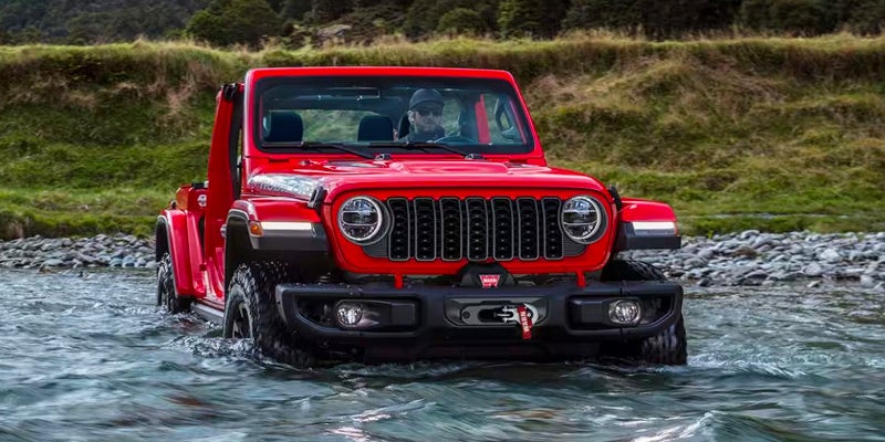 A Jeep Wrangler moving effortlessly through water
